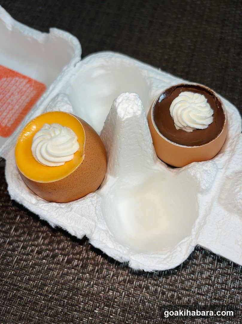 Egg-shaped desserts in carton