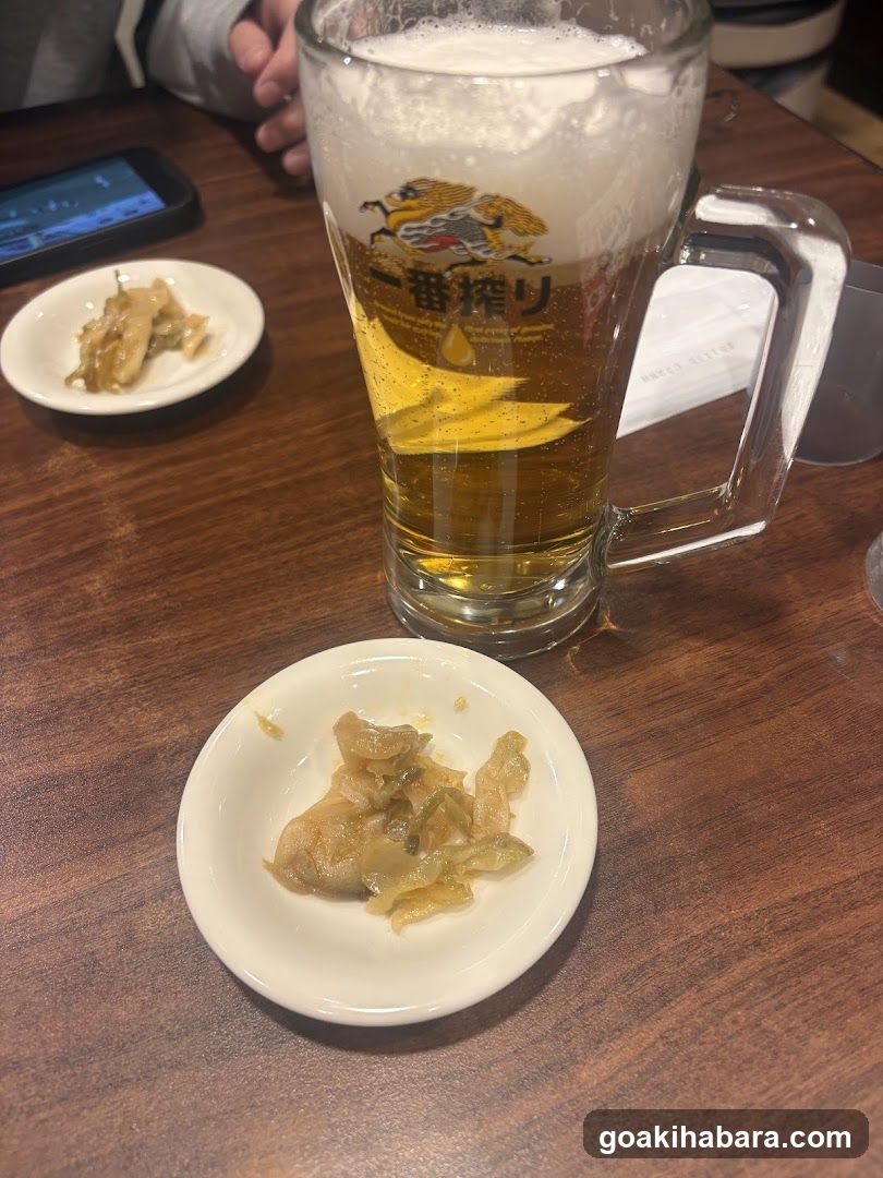 Beer and Pickles at a Table
