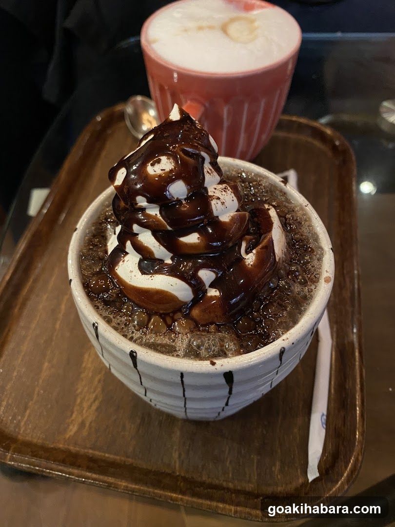 Chocolate Dessert with Whipped Cream and Latte