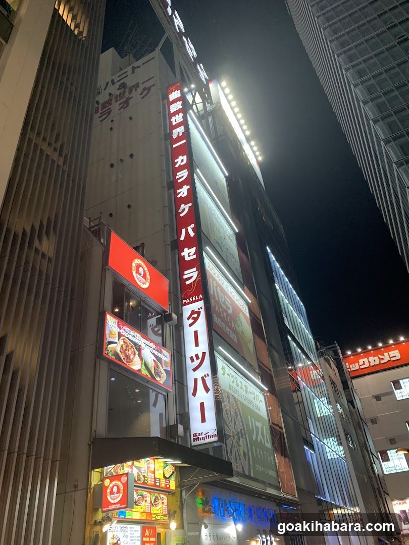 Night street scene with illuminated building facades