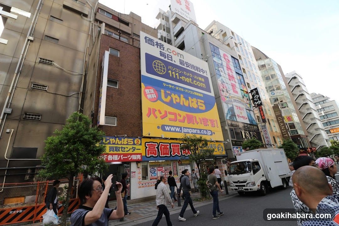 Street scene in Japan with pedestrians and vehicles