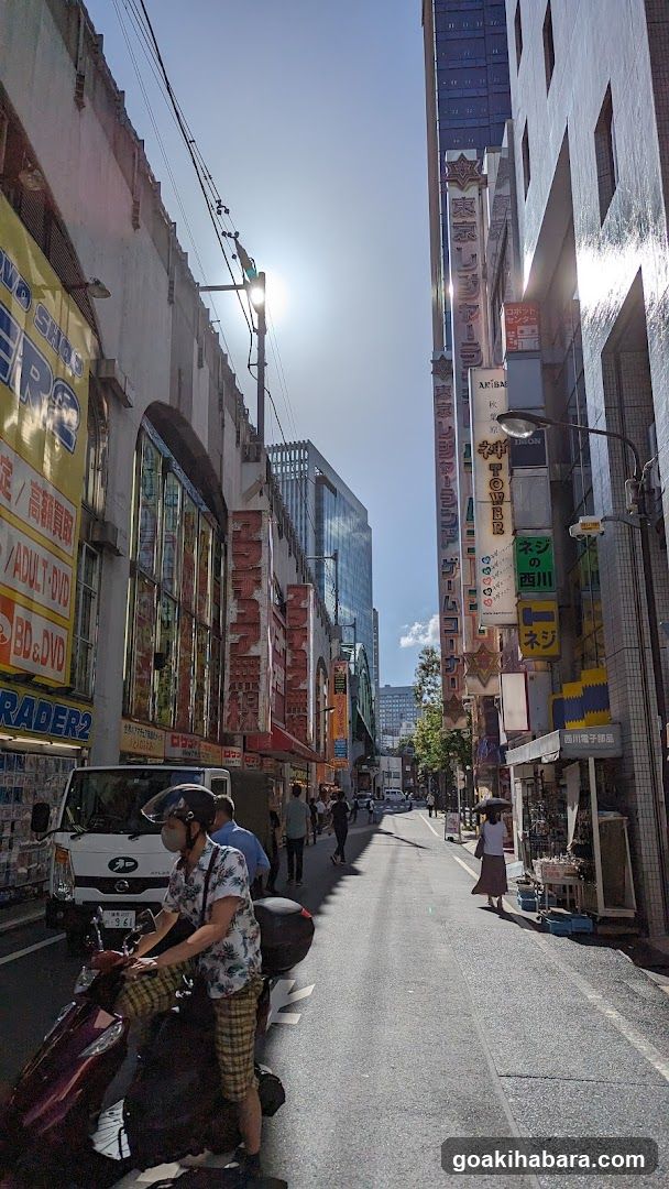 Urban Street Scene with Shops and Motorcycles