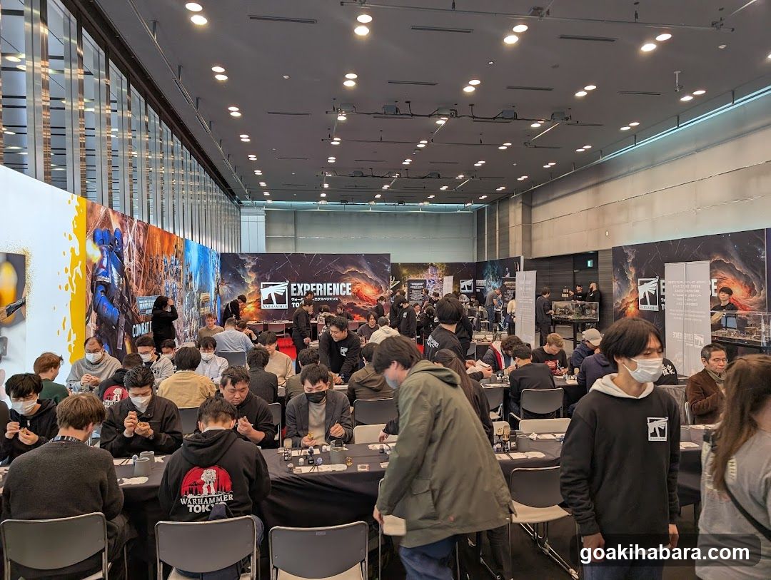 Event Hall Interior with Attendees and Displays