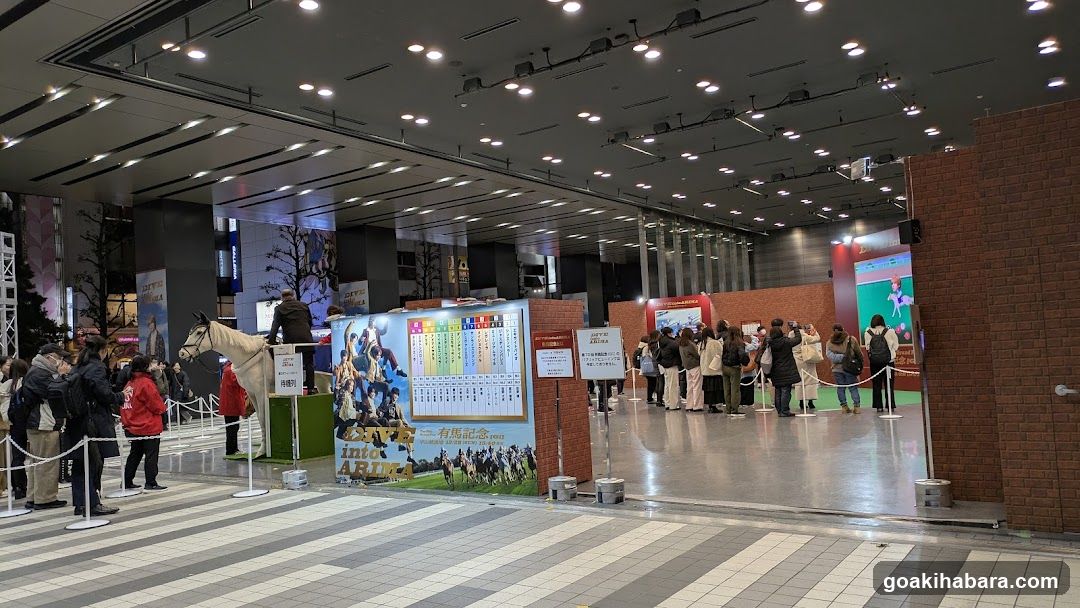 Event Hall Interior with Exhibits and Visitors