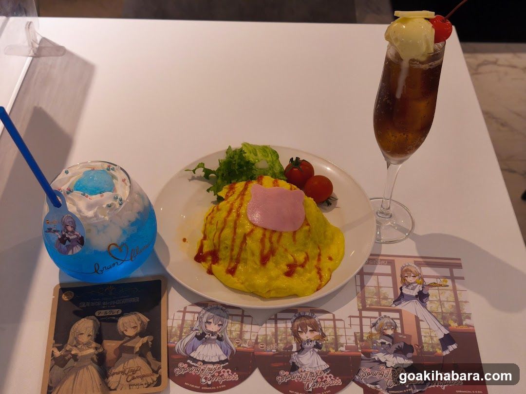 Anime-themed meal set with drinks and merchandise
