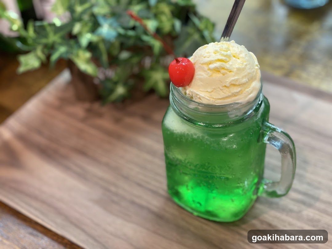 Green Milkshake with Ice Cream and Cherry