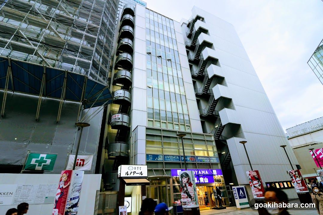 Urban Building Exterior with Construction Scaffolding and Storefronts