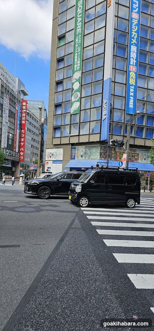 Urban Street Scene with Vehicles and Buildings