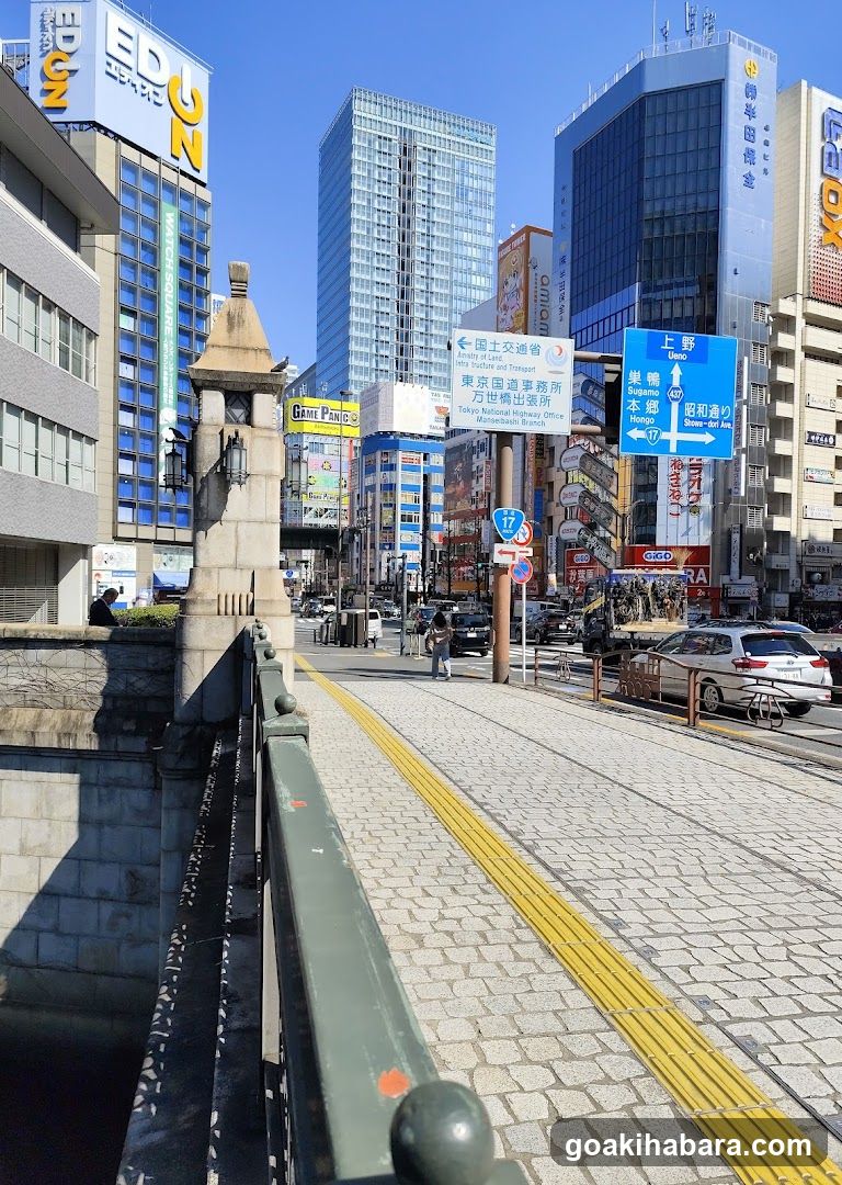 Urban street scene with bridge and signage