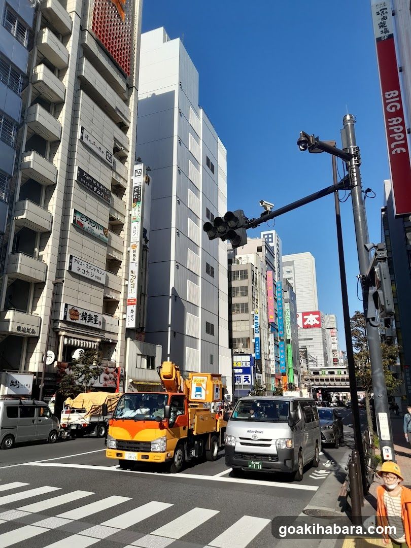 Urban Street Scene with Vehicles and Buildings