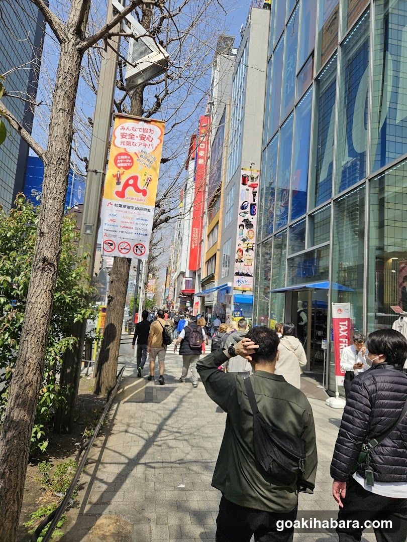 Urban Street Scene with Pedestrians and Storefronts