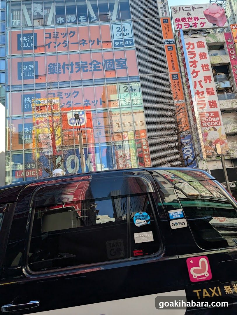 Tokyo Street Scene with Taxi and Storefronts