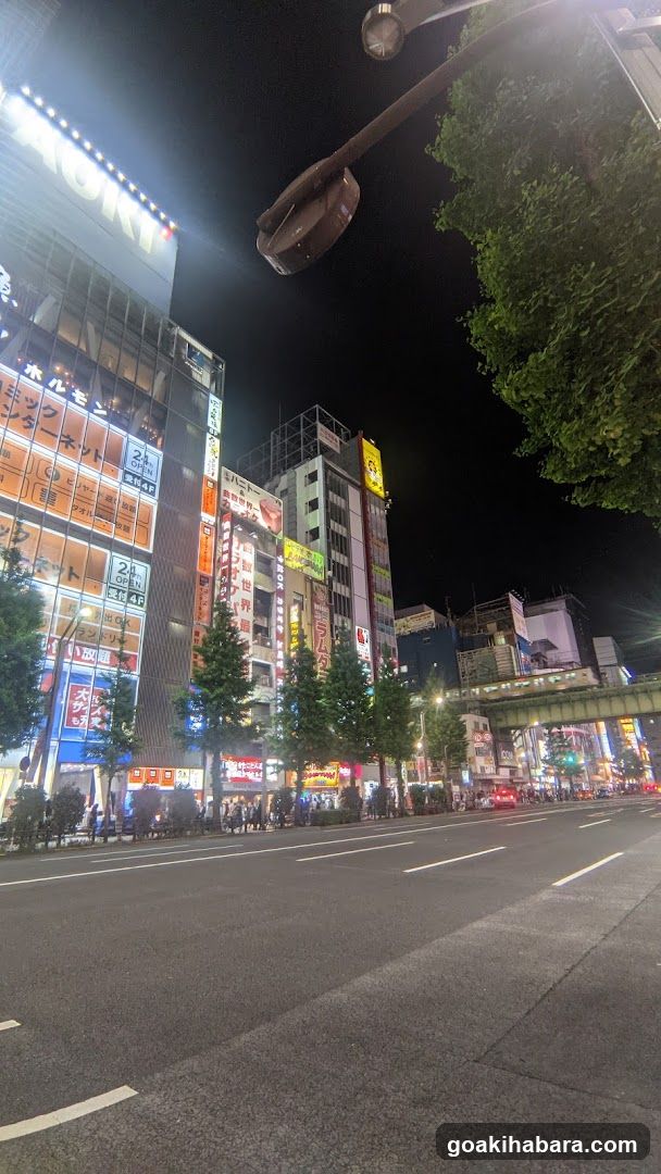 Night street scene with illuminated buildings