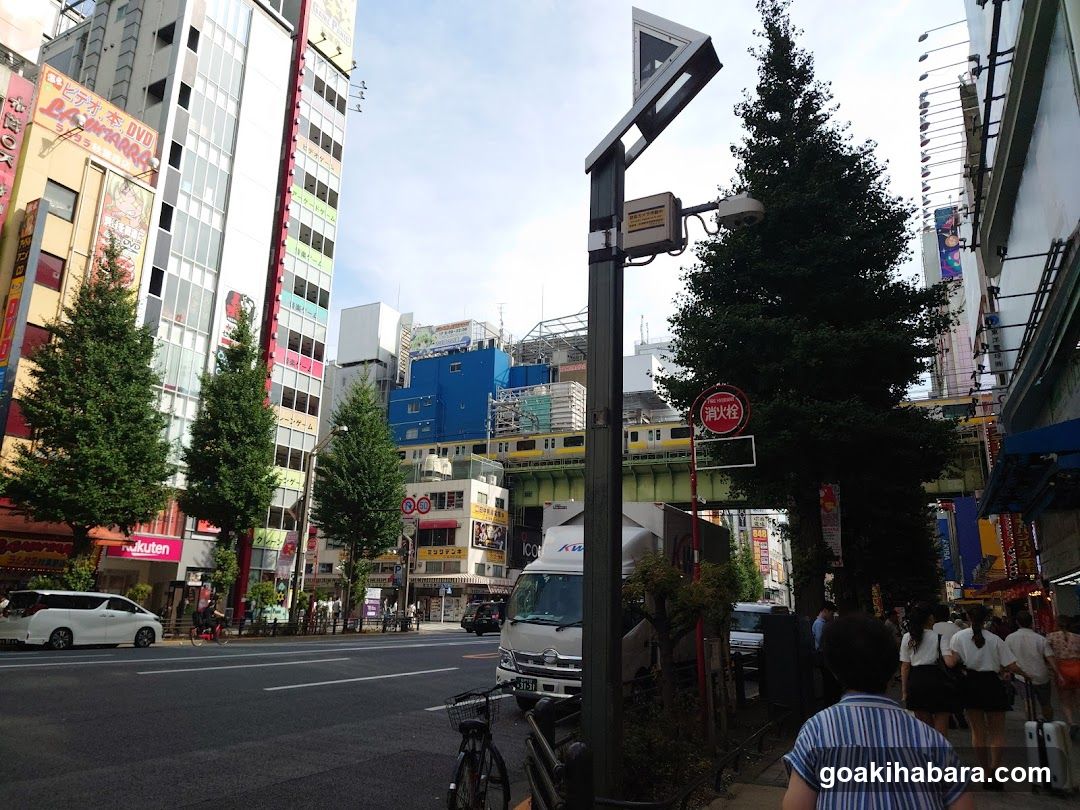 Urban Street Scene with Shops and Vehicles
