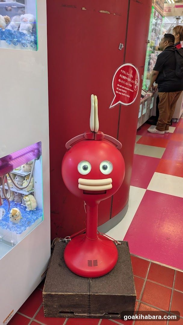 Red mascot figure in arcade store