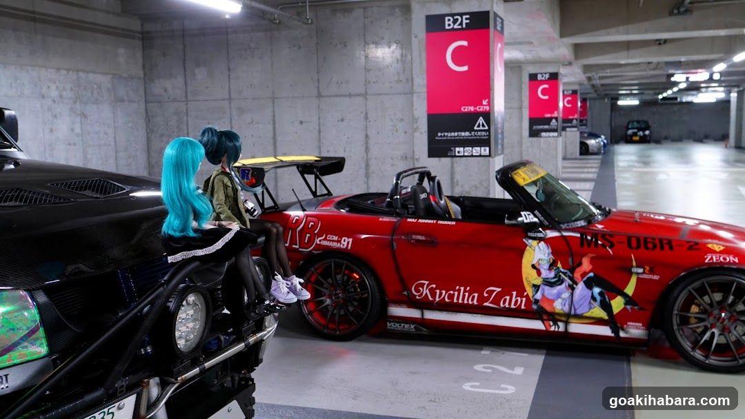 Anime Cosplayers in Parking Garage with Custom Cars