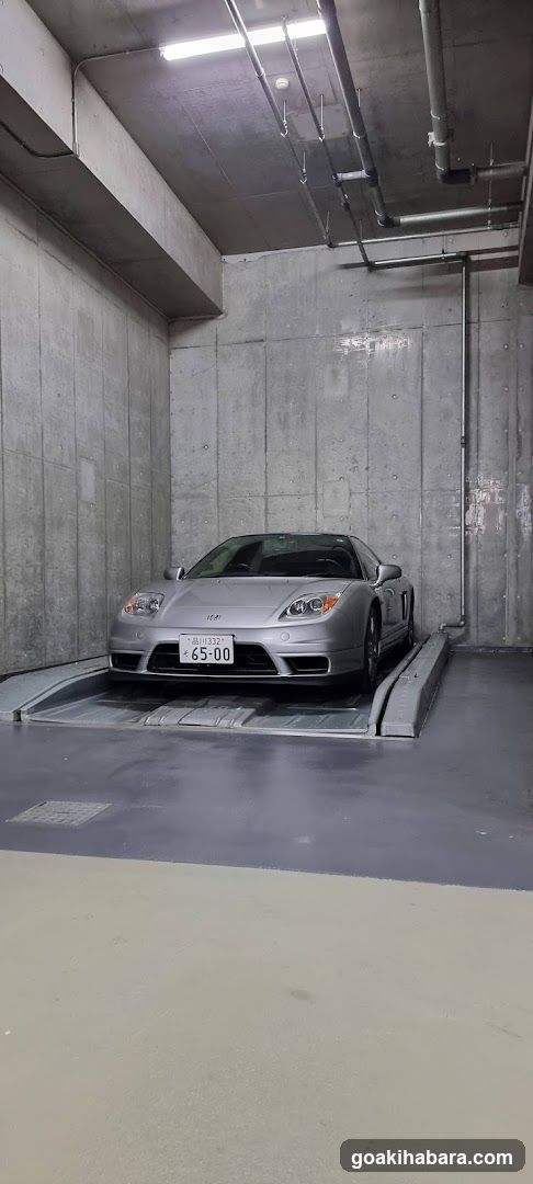 Silver Porsche in Parking Garage