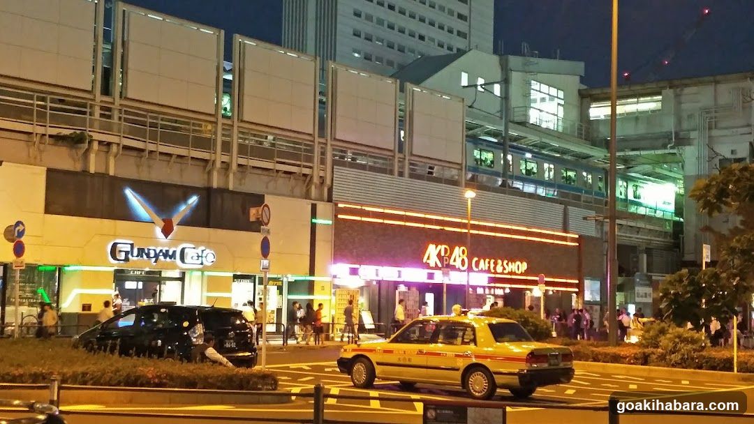 Night Street Scene with Shops and Vehicles