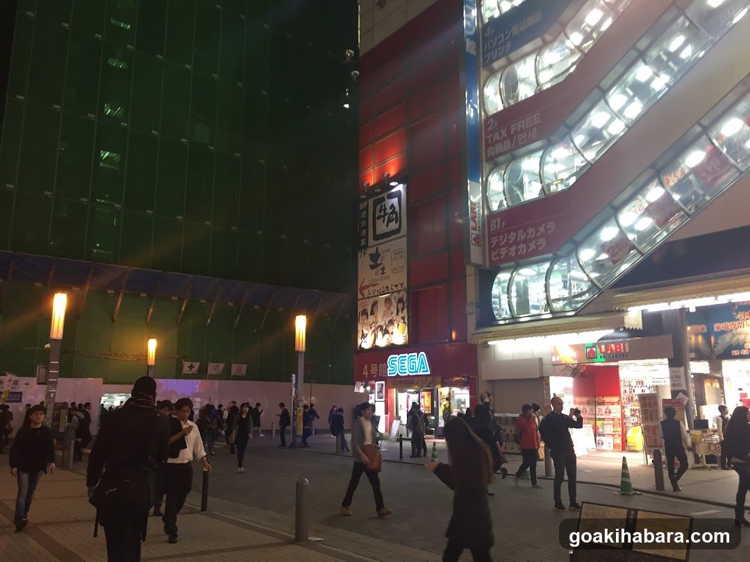 Night Street Scene with Shops and Pedestrians