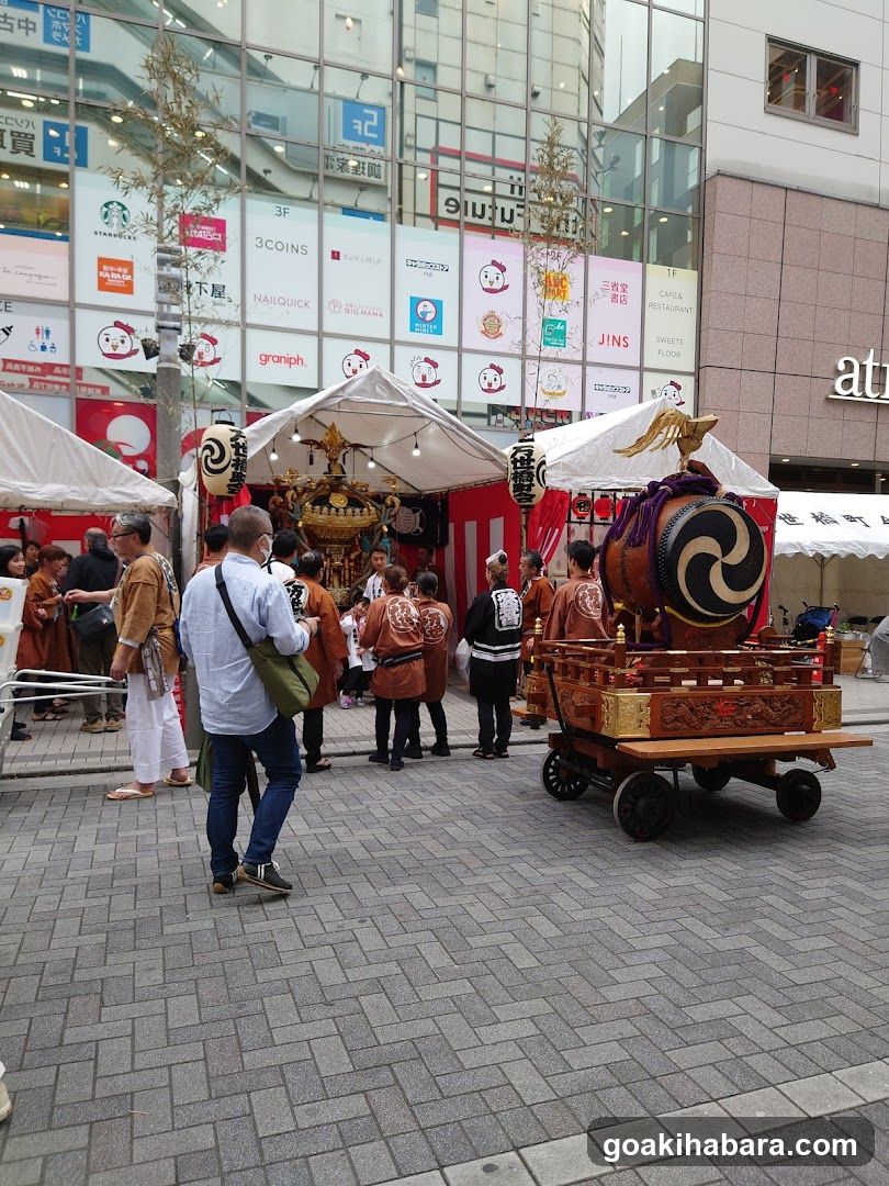 Festival Scene with Traditional Drum and Market Stalls