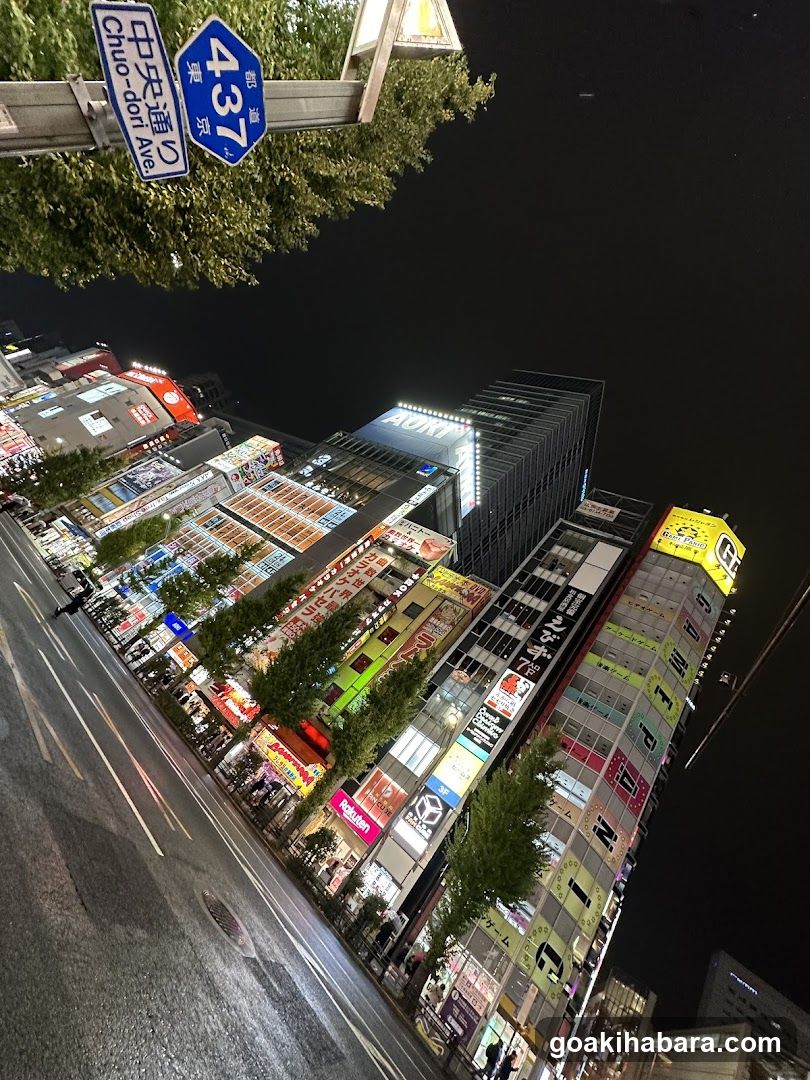 Night street view with illuminated buildings and signs