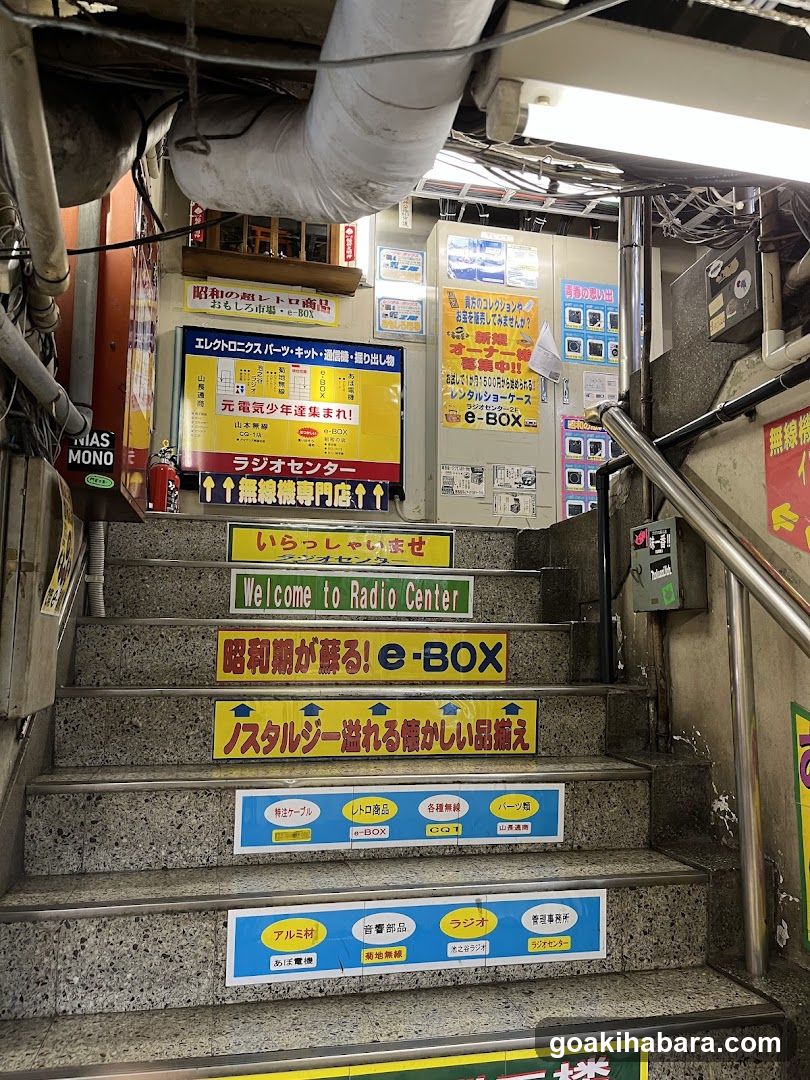 Staircase with Japanese Signage and Storefront Advertisements