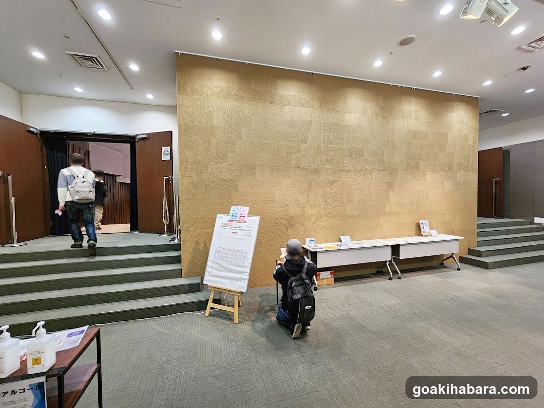 Event Hall Interior with Display Board and Tables