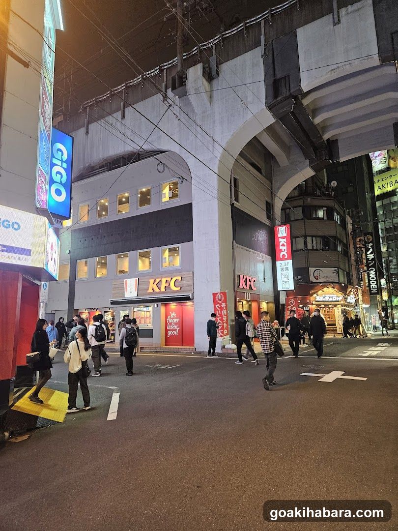 Night street scene with KFC and Gigo signs