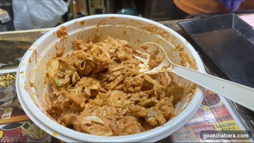 Bowl of creamy Korean-style stir-fry with cabbage and meat