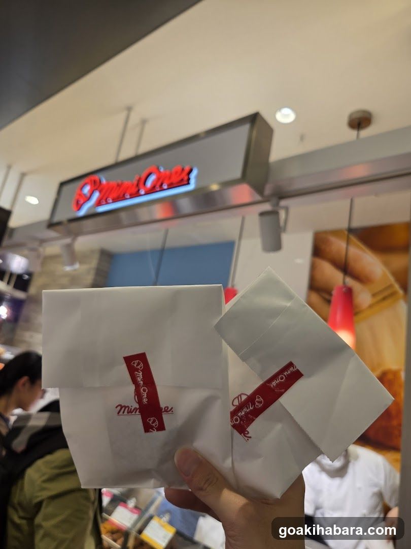 Food items held in hand near store entrance