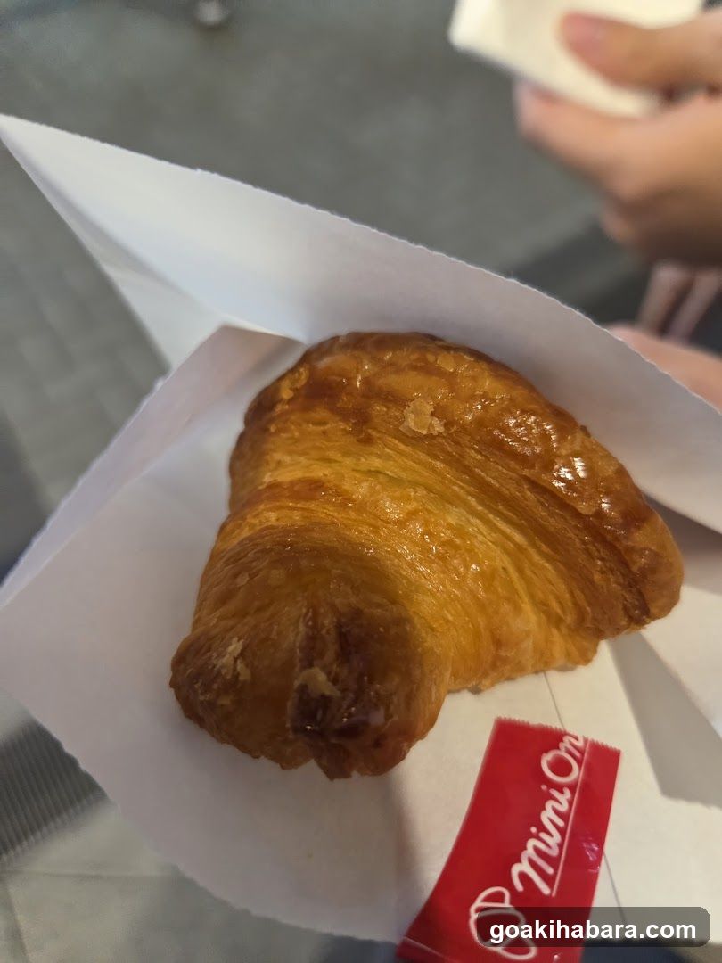 Croissant in Paper Wrapper