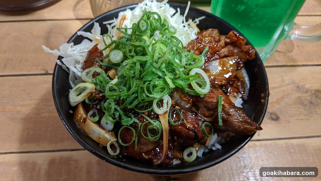 Bowl of Grilled Meat with Scallions and Cabbage