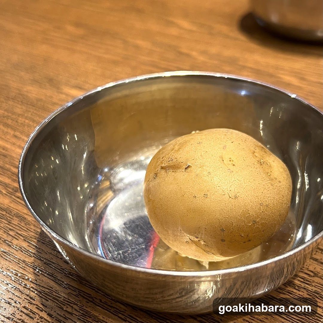 Potato in a metal bowl