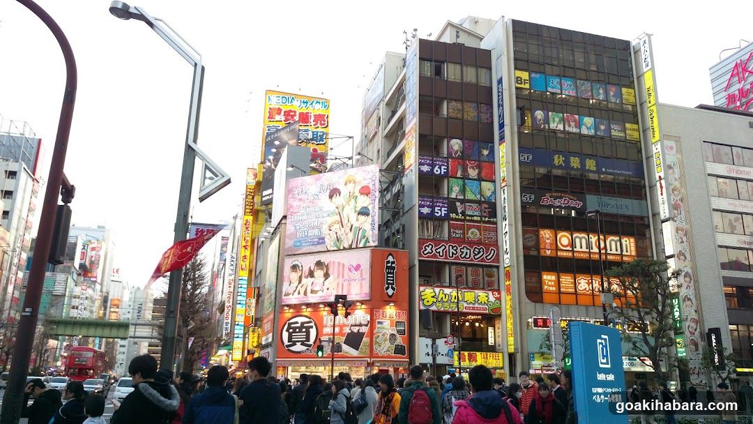 Crowded Street with Neon Signs