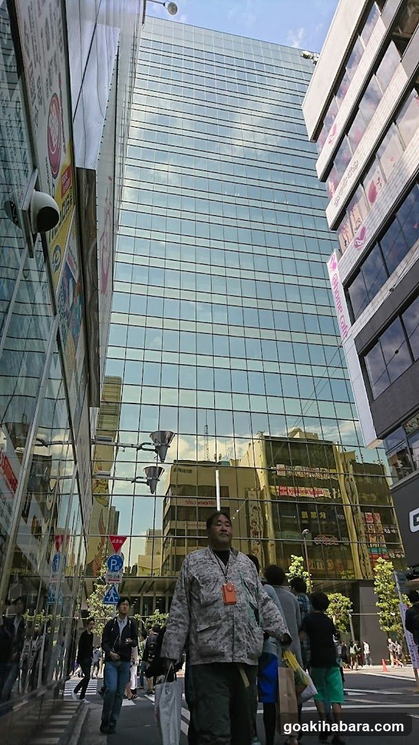 Urban Street Scene with Pedestrians and Glass Building