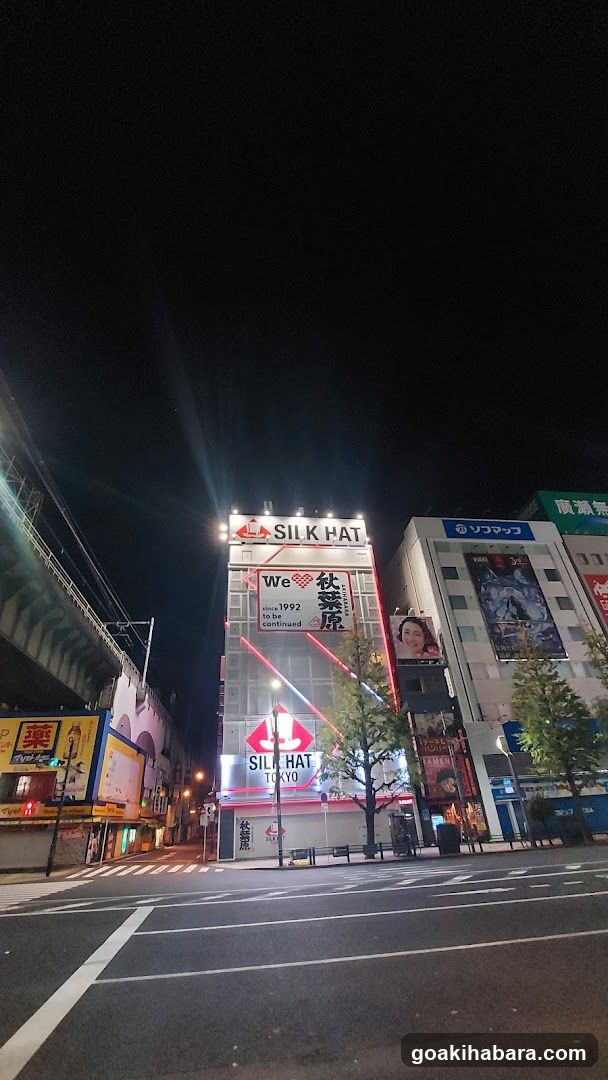 Night street scene with illuminated buildings