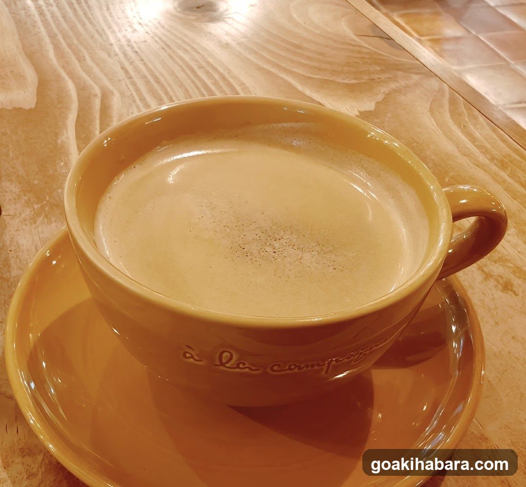 Yellow Coffee Cup on Wooden Table