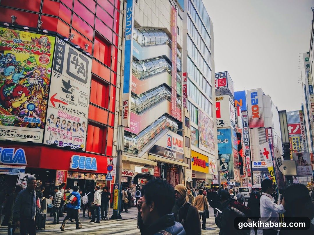 Busy Japanese Street Scene with Shops and Crowds
