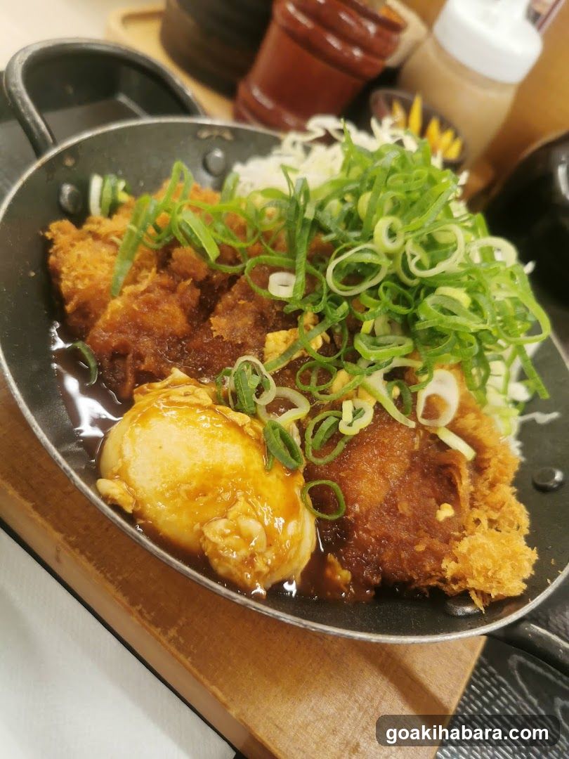 Fried Chicken Dish with Egg and Onions