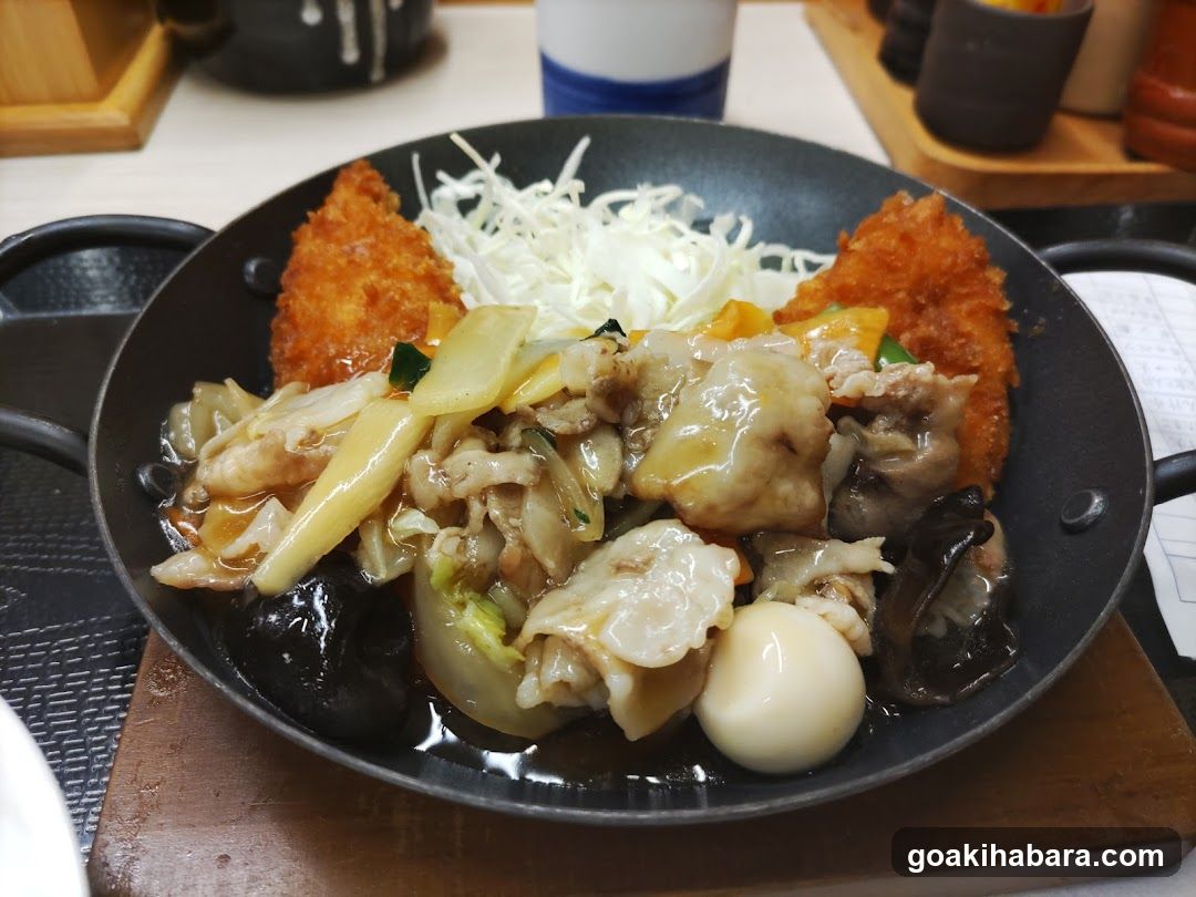 Japanese-style stir-fry with fried cutlet and egg