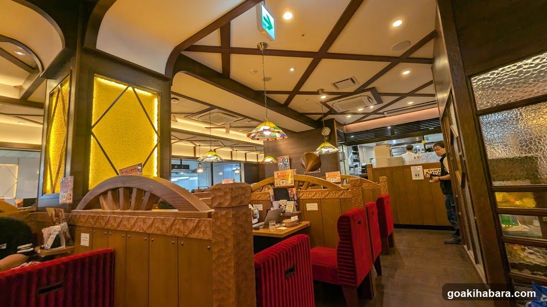 Restaurant Interior with Wooden Booths and Red Cushions