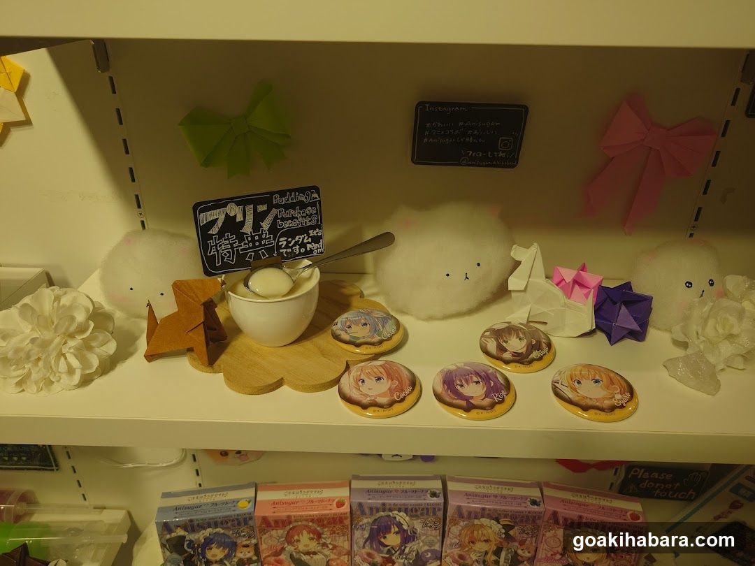 A shelf display of anime merchandise and plushies