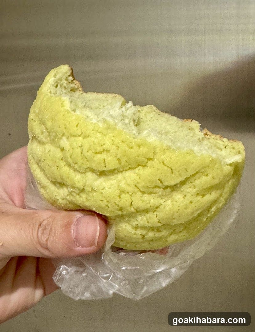 Hand holding yellow pastry