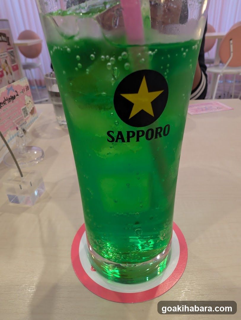 Sapporo Beer Glass with Green Liquid