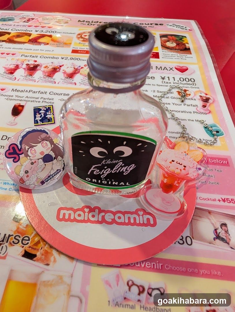 Maidreamin Bottle and Merchandise Display