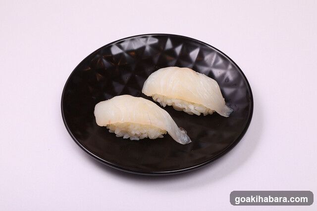 Sushi on a black plate