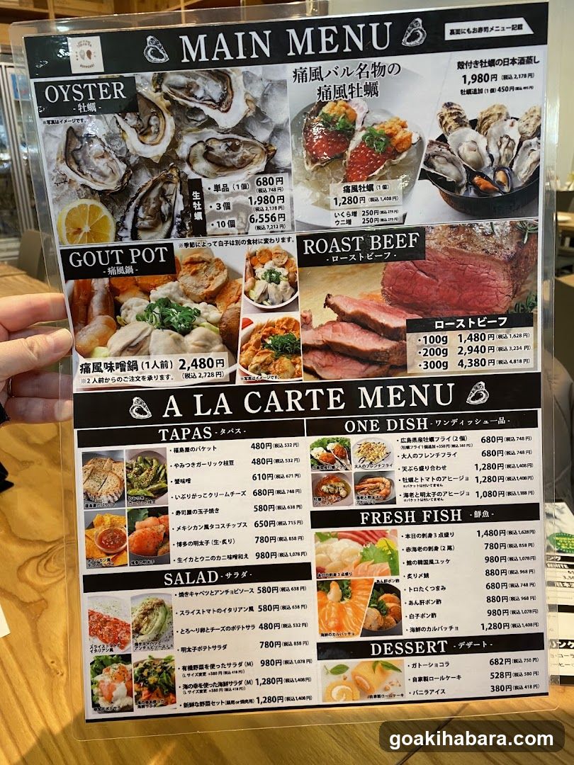 A clear plastic menu board held by a hand, featuring sections like Oyster, Gout Pot, Roast Beef, Tapas, One Dish, Fresh Fish, Salad, and Dessert with prices in Yen.