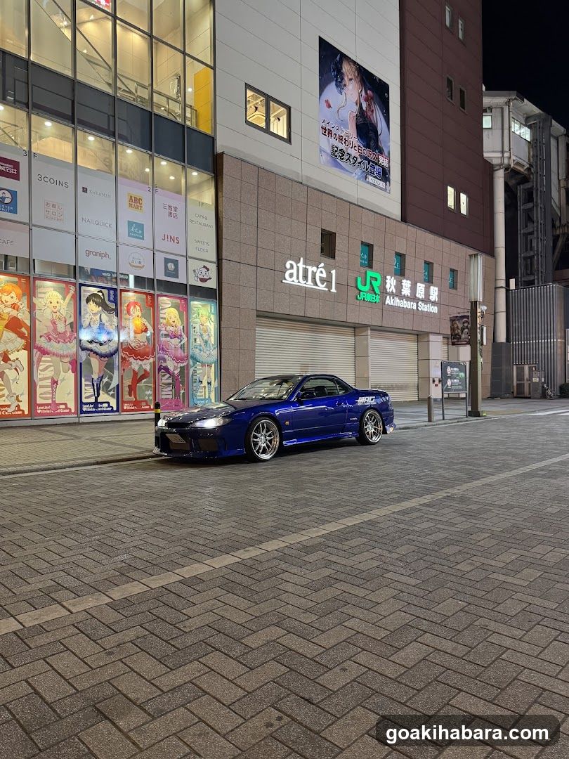 Blue Car in Urban Street at Night