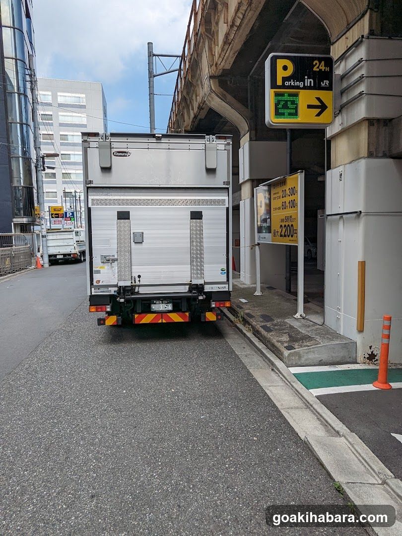 Truck parked near parking entrance